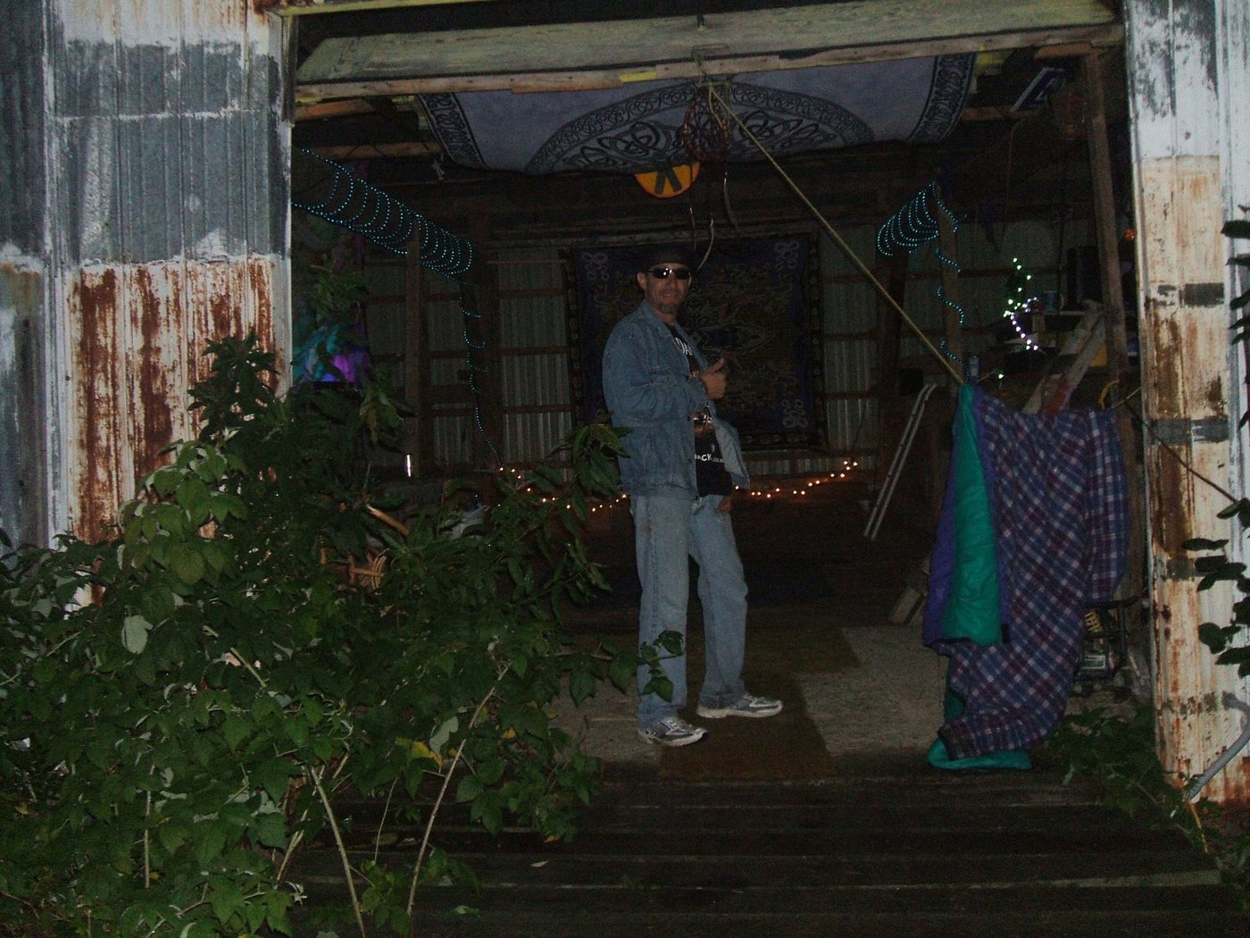 In the barn, at night, with string lights.