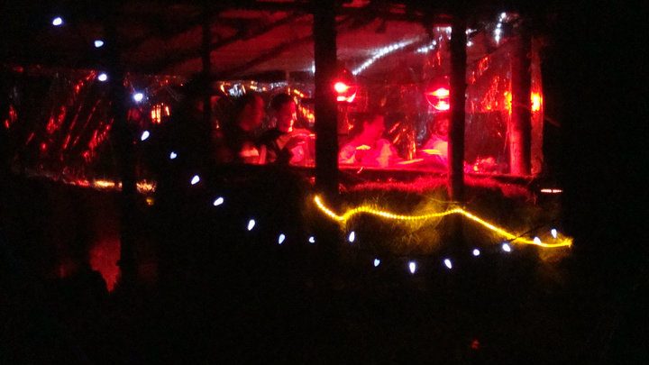A festival night, string lights and floodlights.