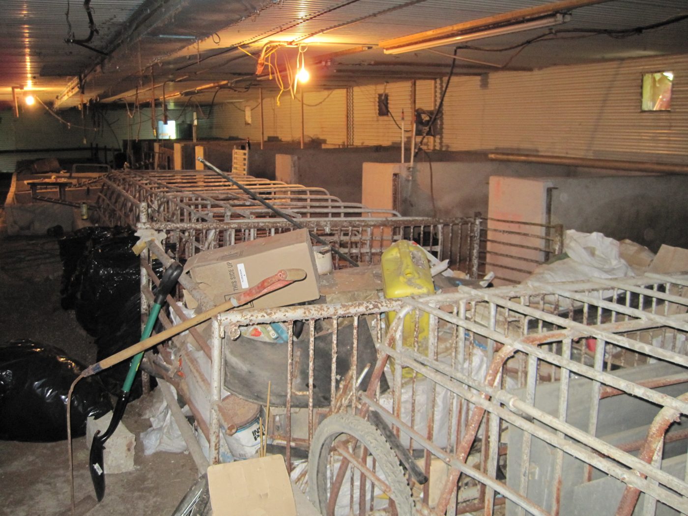 The remains of the old cages, garbage bags, pipes.