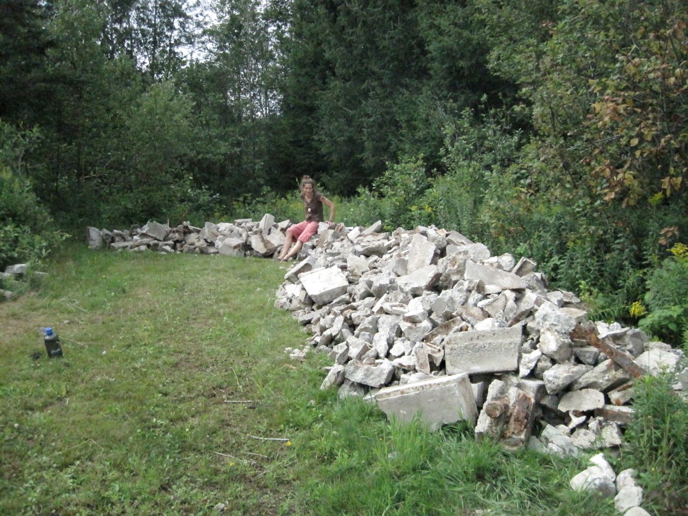 August 4, 2010: the rubble taken out, piled in the field.