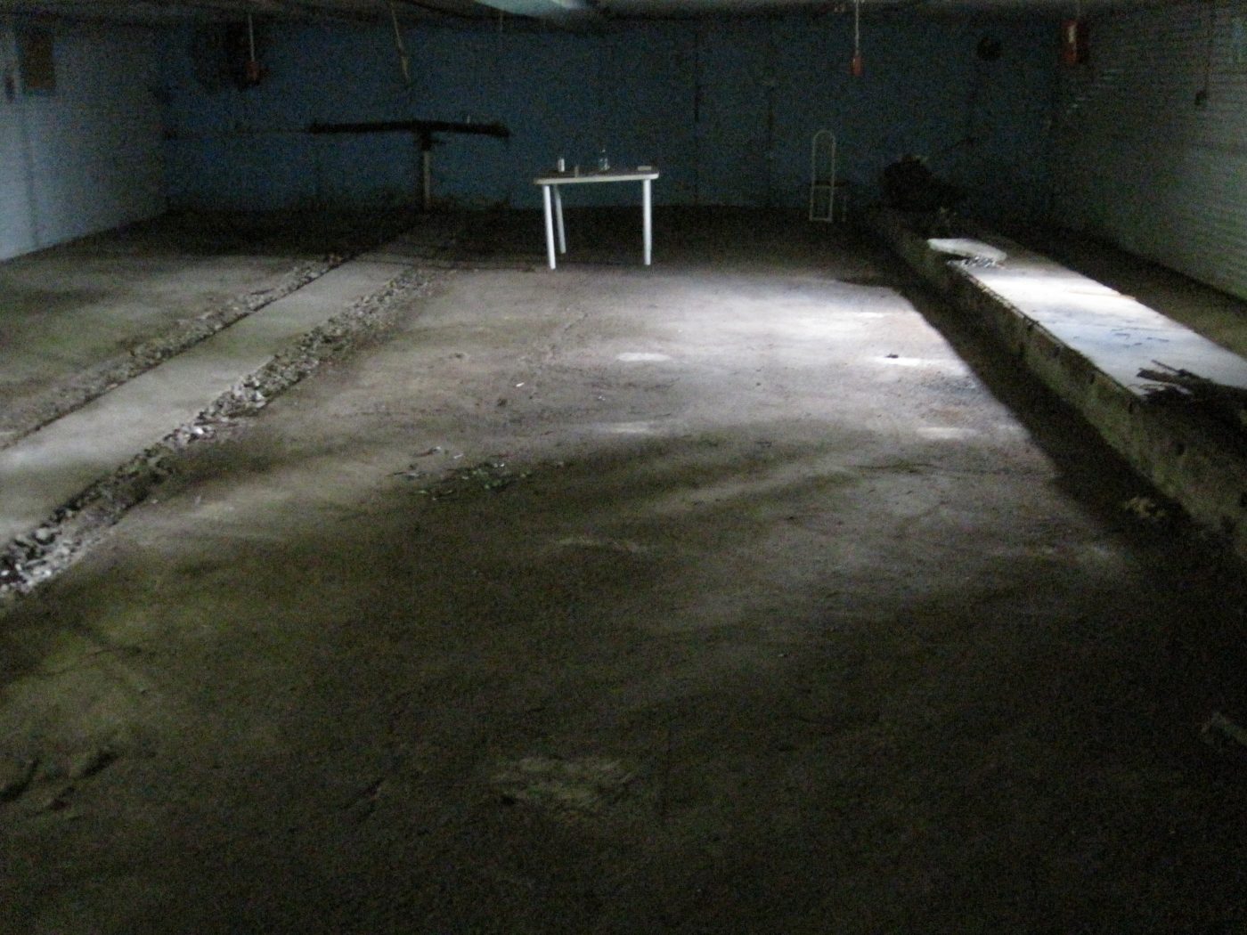 August 4, 2010: the bare floor, a table, a chair.