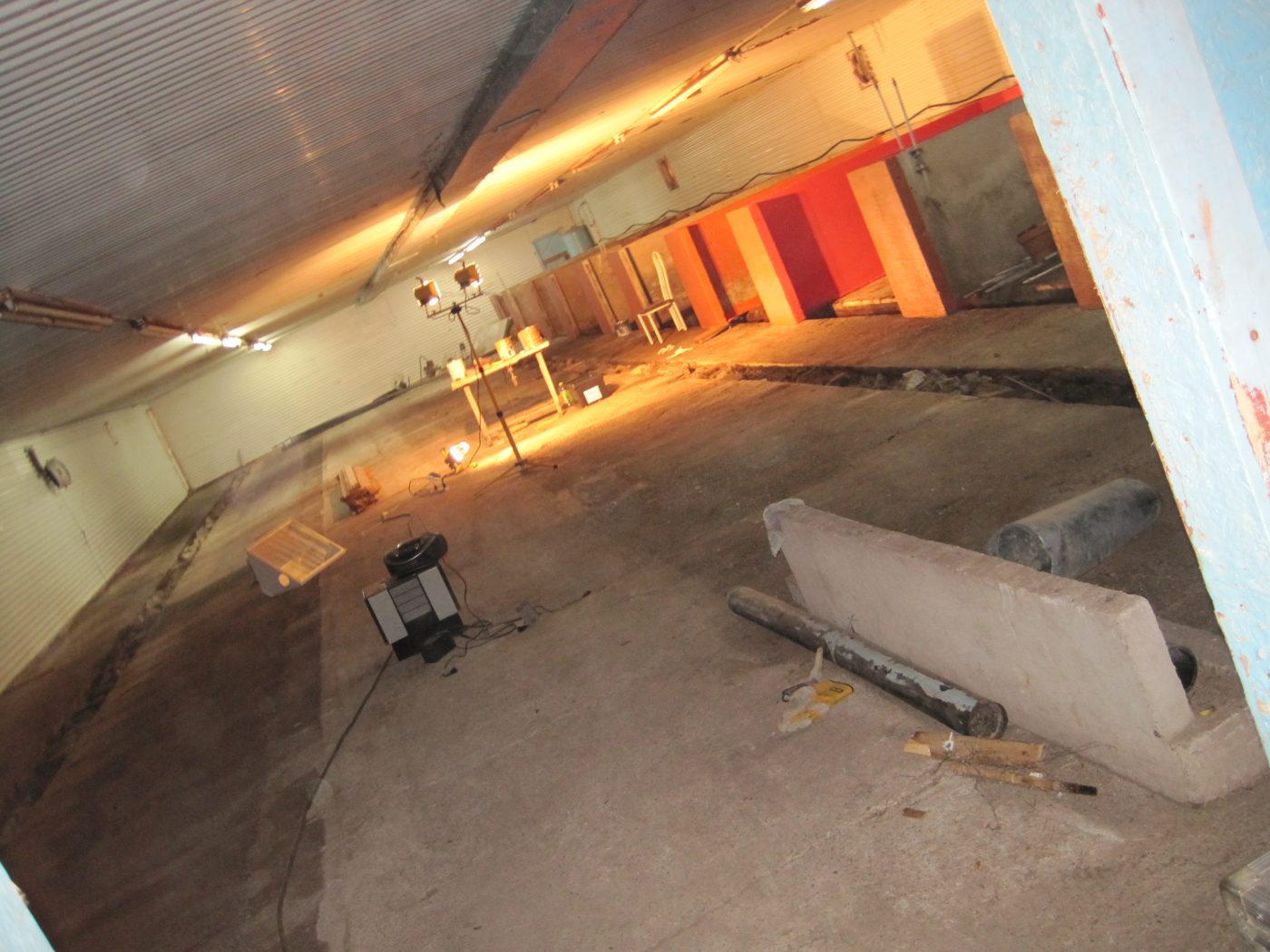 September 2010: the emptied bunker, the first red lodges under construction under the neon lights.