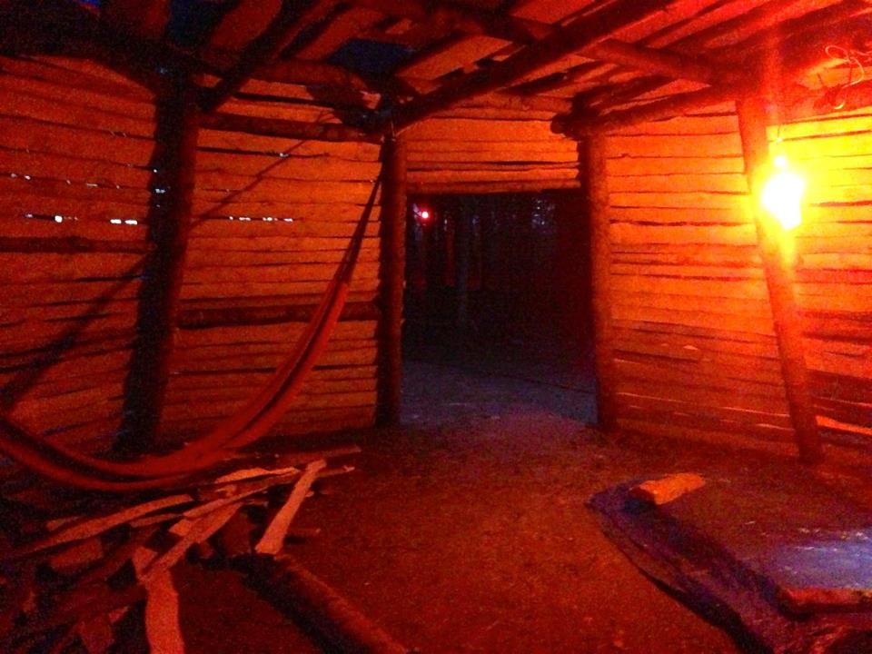Inside the tipi, in red light.