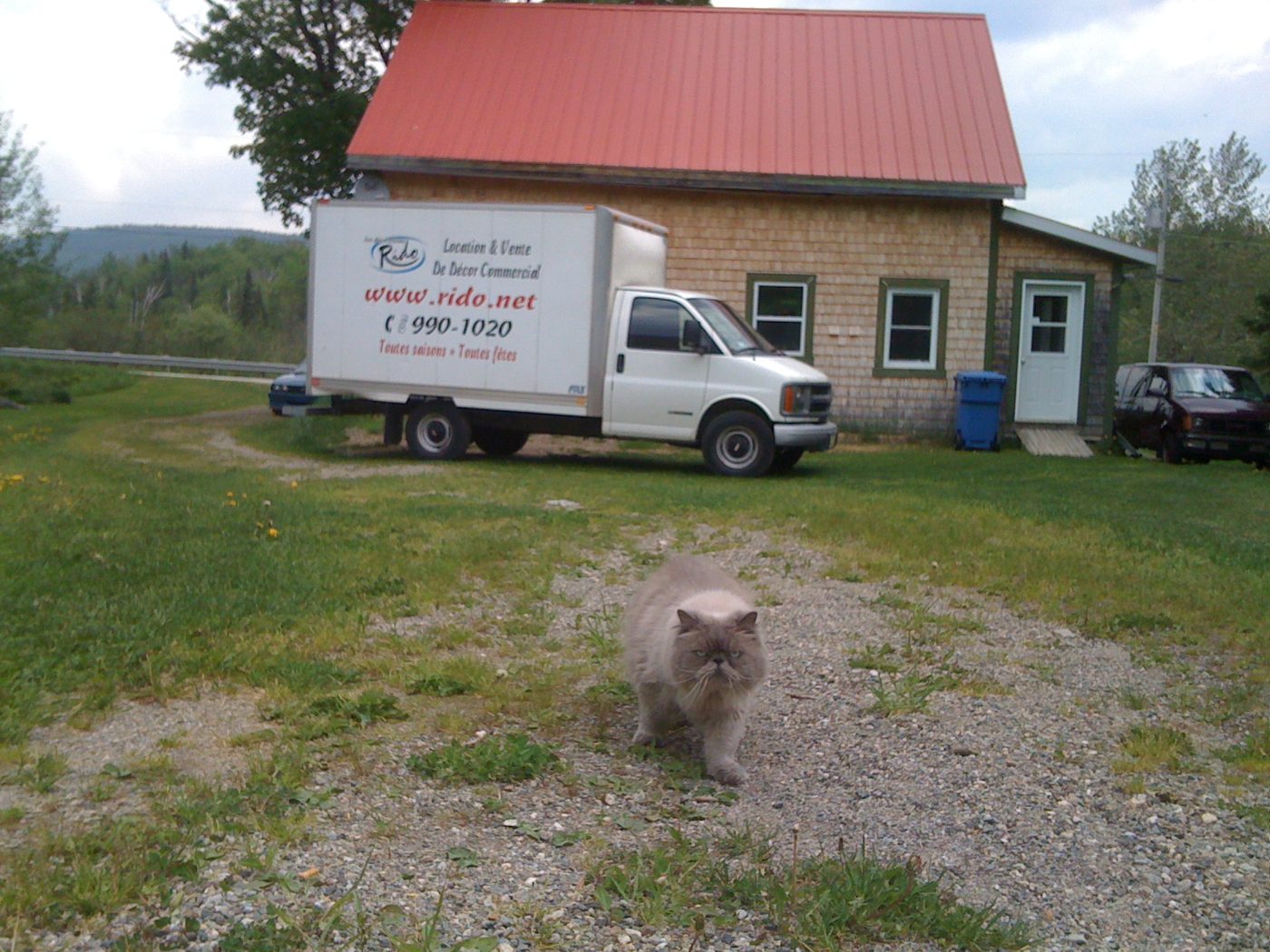 May 30, 2010: the moving truck in front of the red-roofed house, 81 route 263.