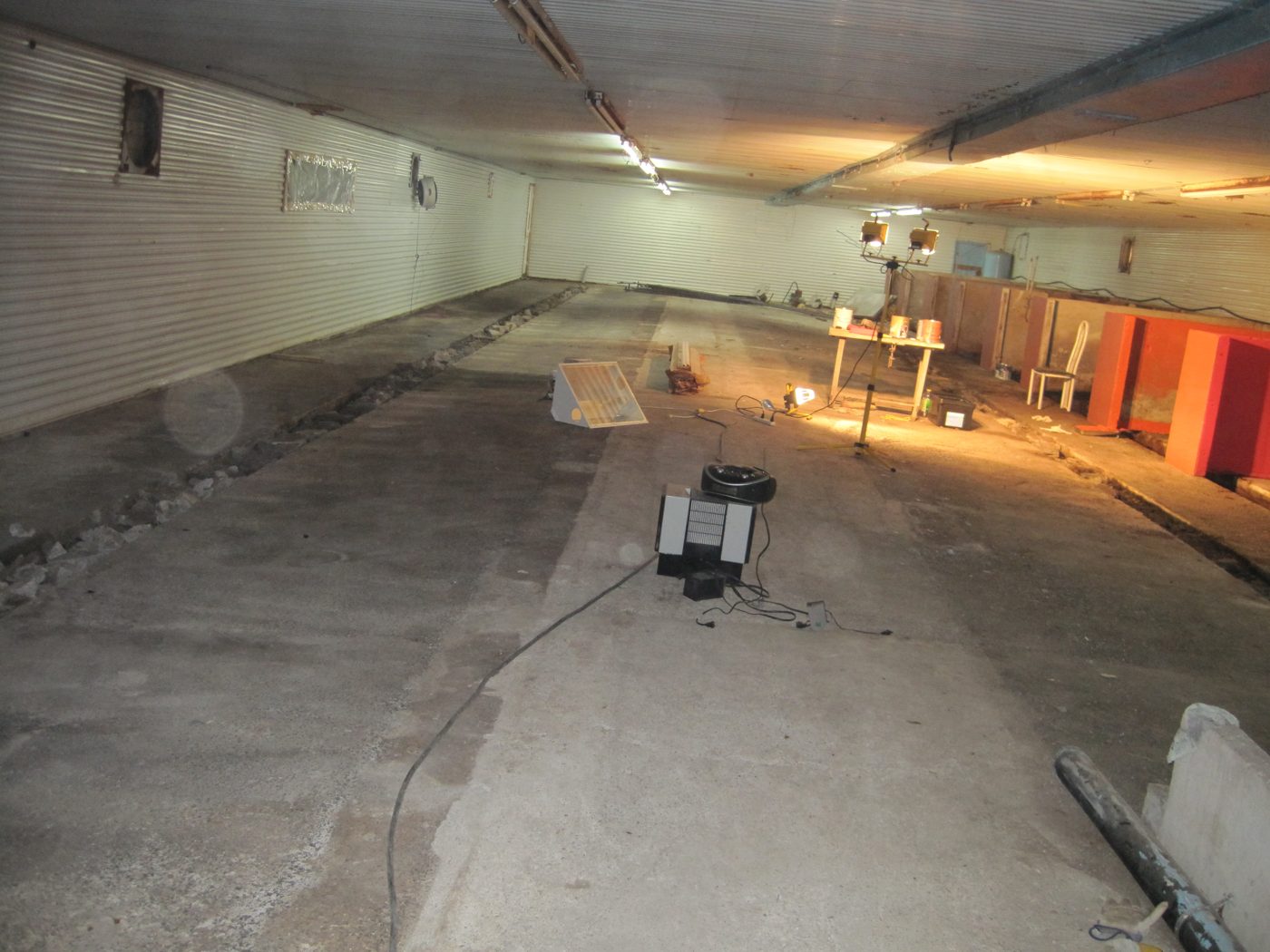 The long corridor of the lodges, a lamp at the end.