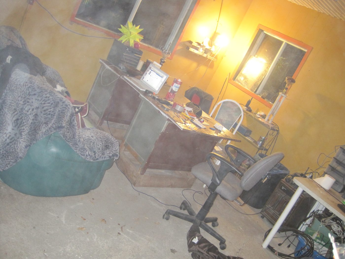 The office, set up in a corner: computer, net, plant.