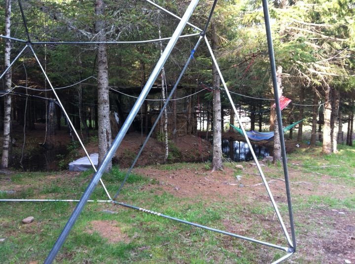 May 23, 2011: the geodesic dome rises in front of the spruces.