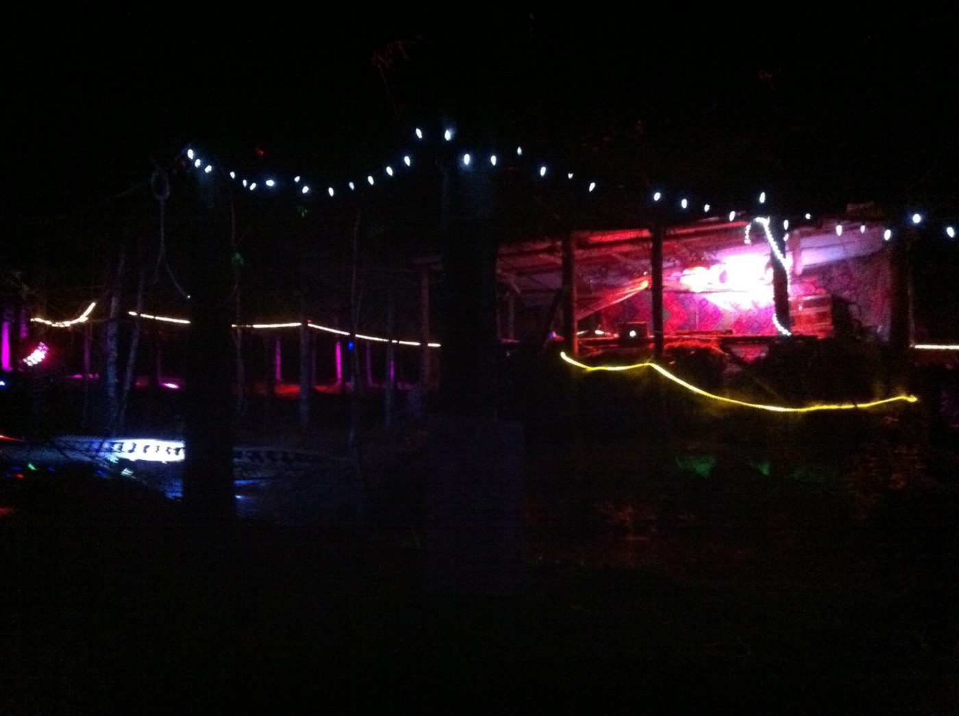 The stage lit up, string lights and floodlights.