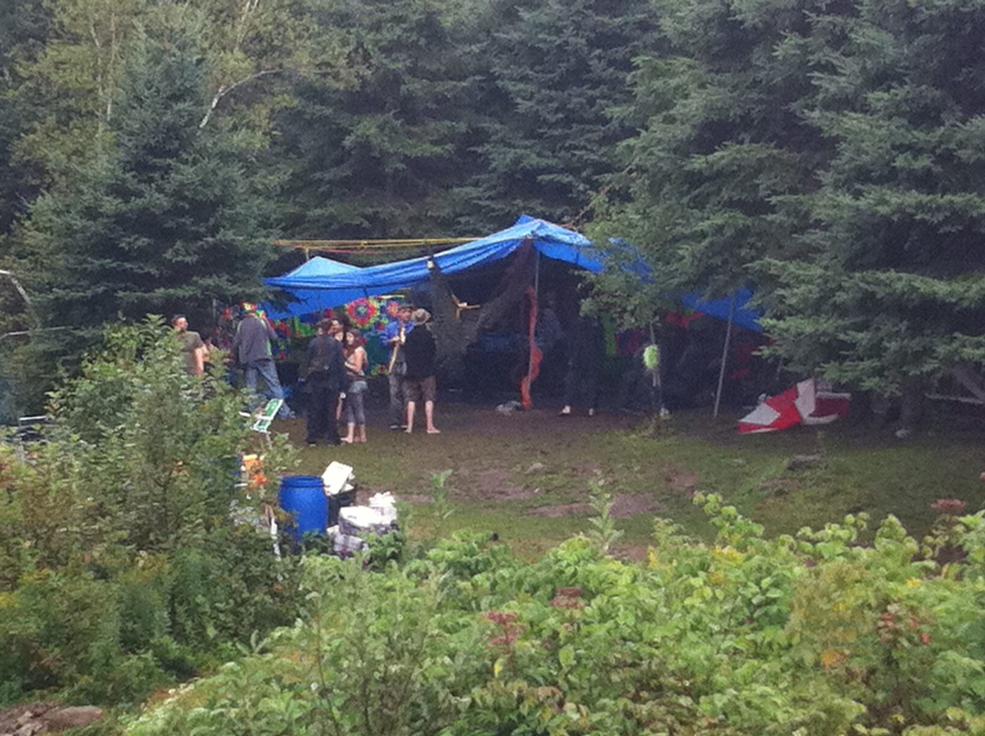 The camp under the blue tent, on a rainy day.