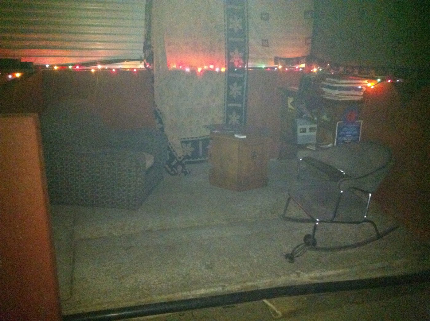 November 2011: a furnished lodge, string lights and armchairs.