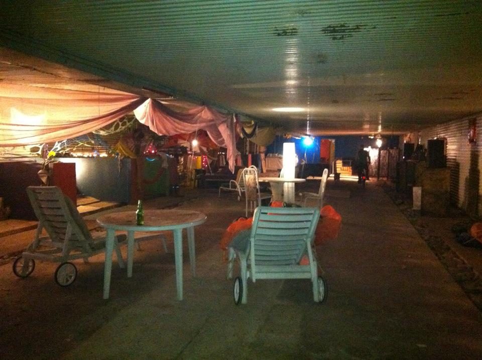The bunker's big hall, hung with fabric, with its garden chairs, 2012.