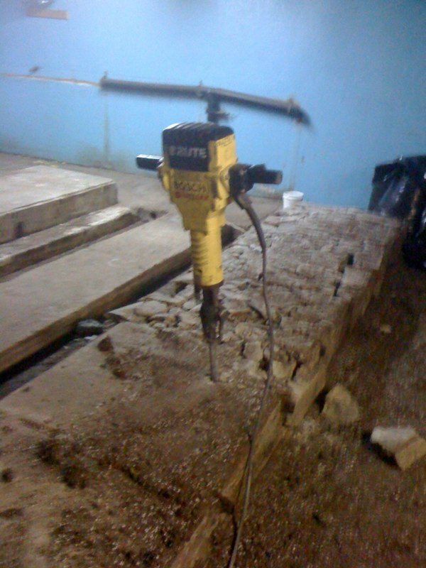The concrete of the pig pens, piece by piece.