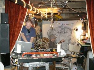 The loft's studio, with its canvases and lamps.