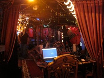 The loft's living room: computer, Buddha, fabrics.
