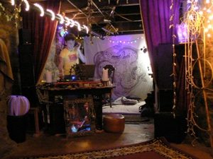 The loft's stage, between the hammocks and the lamps.